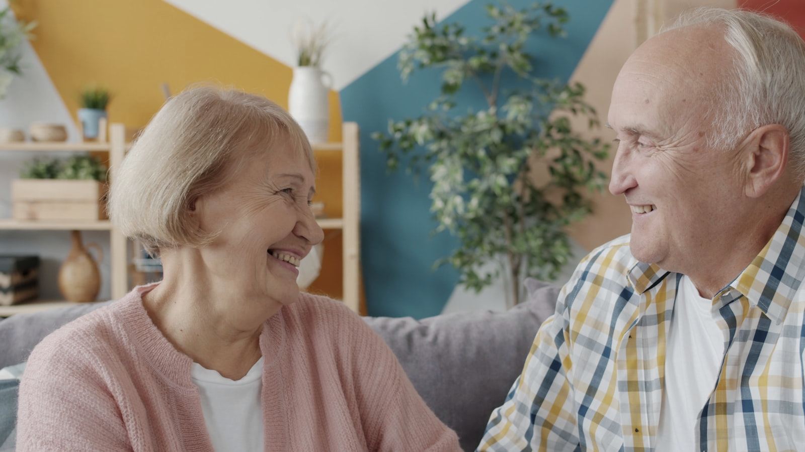 An older couple laughing together