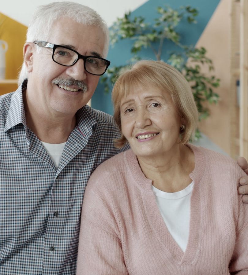 A smiling older couple